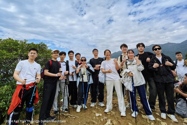 Lab members pausing together beside the trail on Danan Mountain